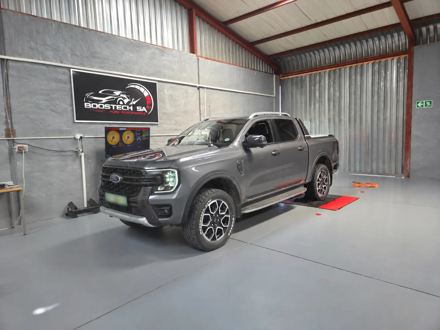 Ford Ranger positioned on the dynamometer inside the Boostech workshop