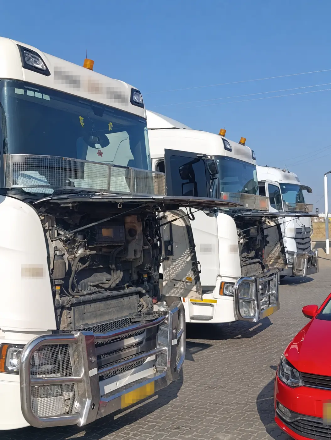 Scania G410 fleet with identifying details obscured